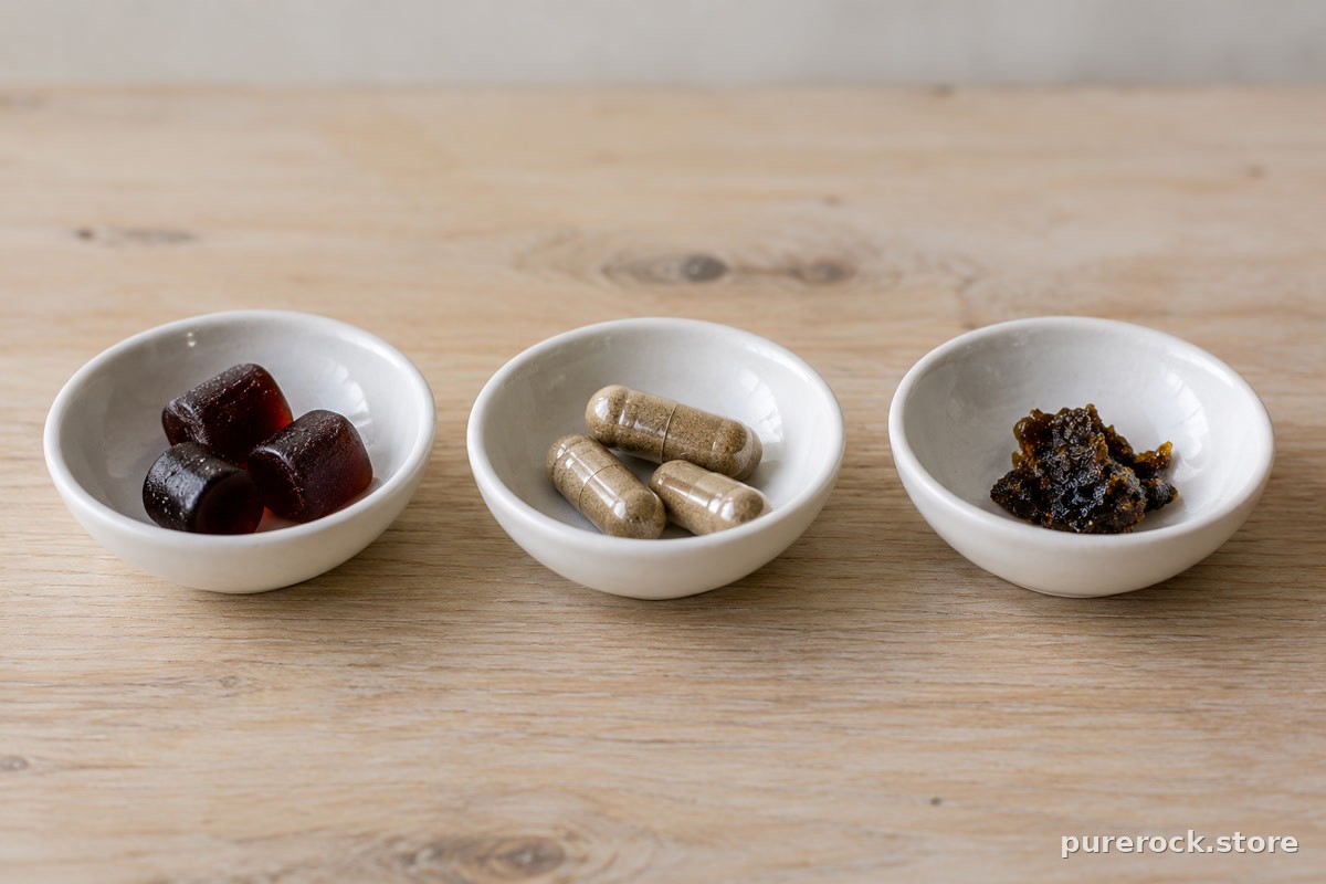 Three small dishes holding gummies, plain capsules and a pea-sized piece of dark resin
